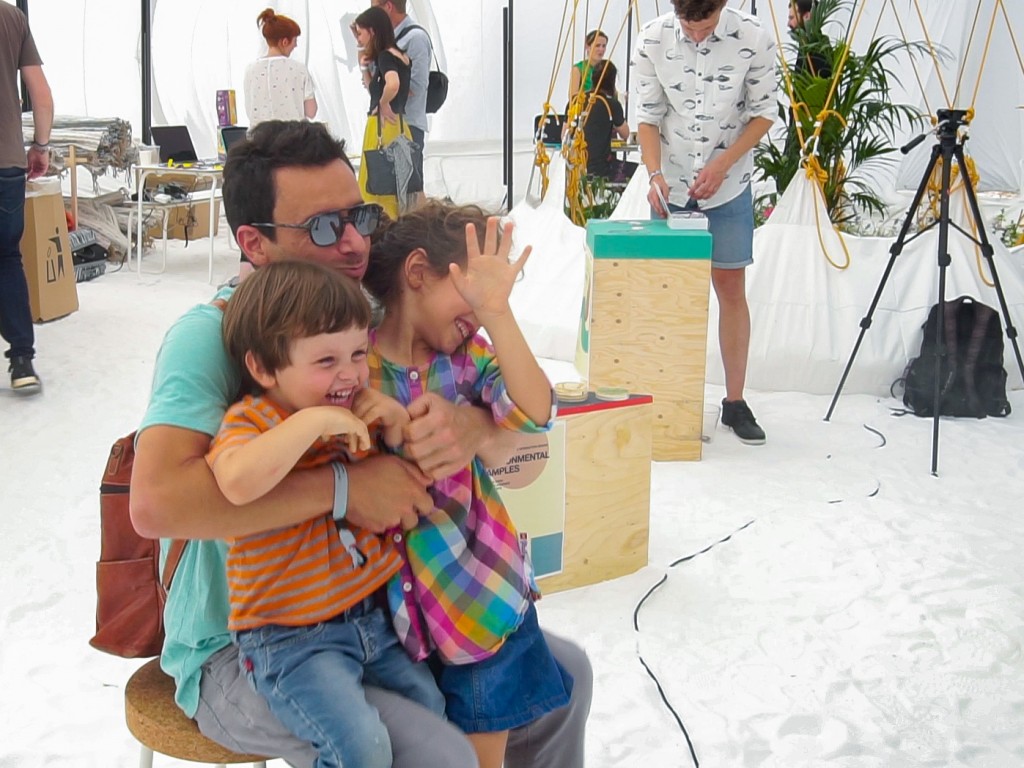 A dad and his two kids getting hit by bob's smoke ring.